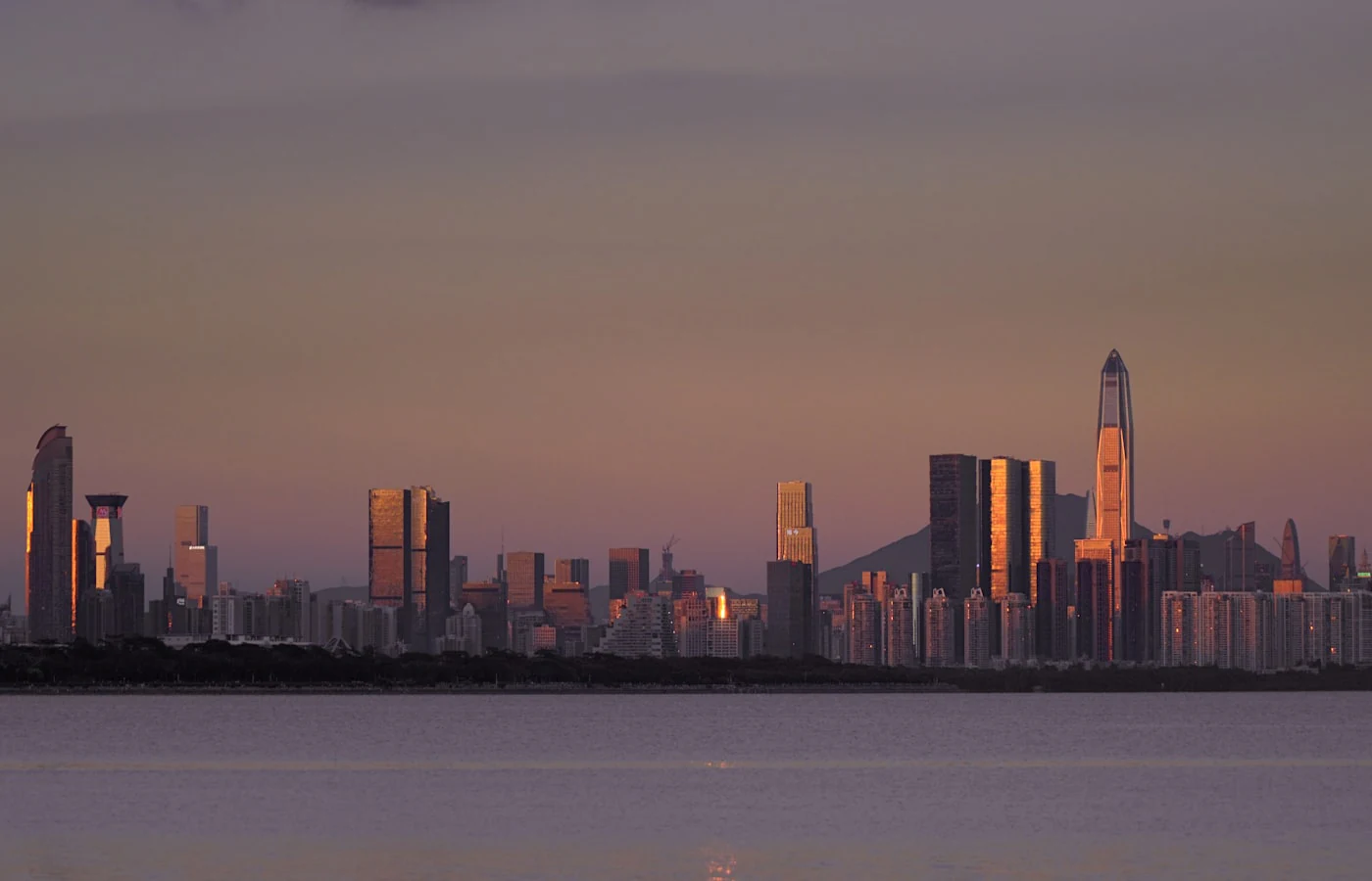 Shenzhen skyline beside the bay at sunset